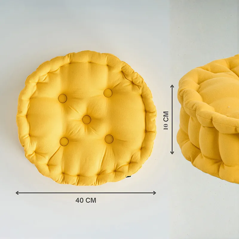 Top and side view of a round mustard yellow floor cushion