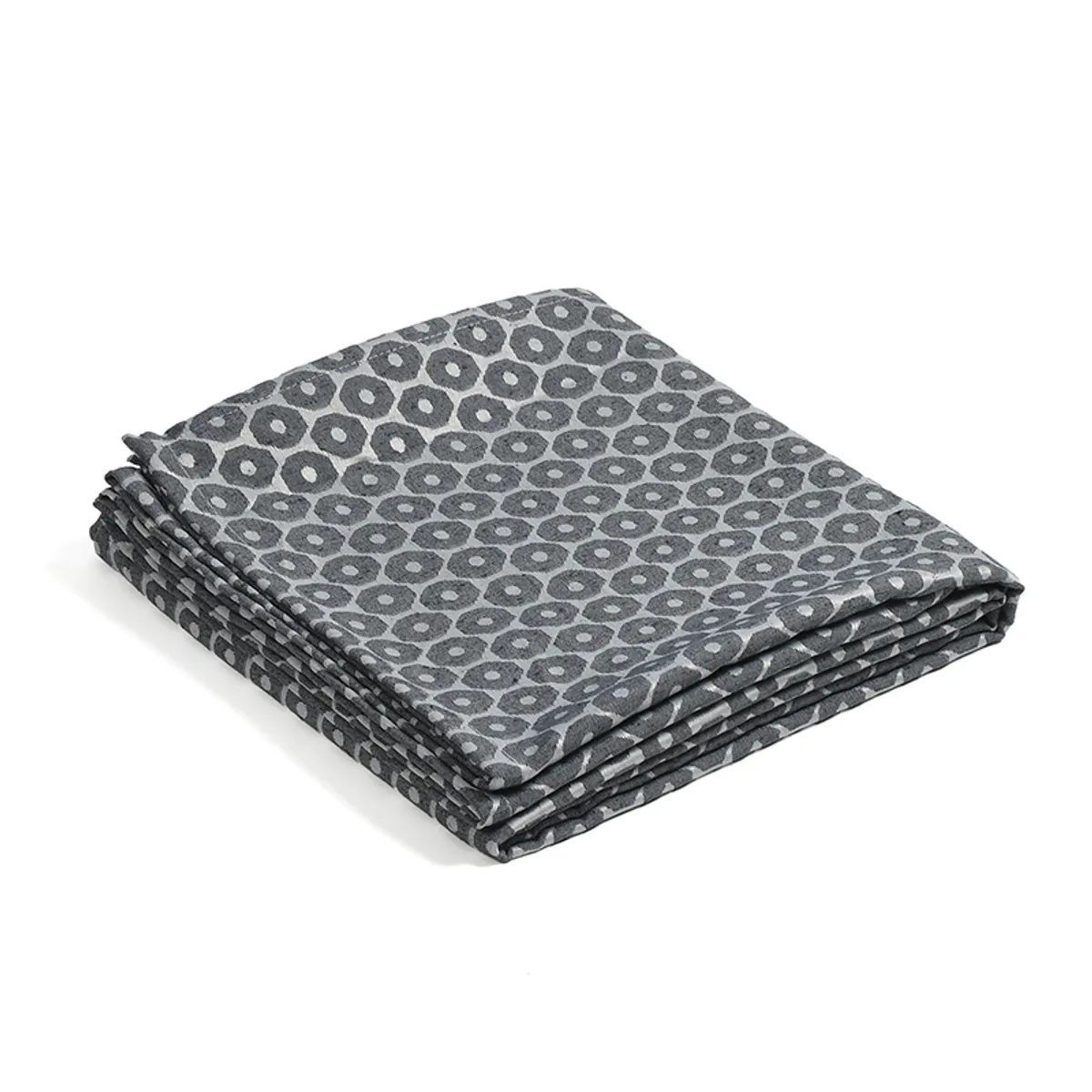 Folded blue and grey geometric throw on a plain background