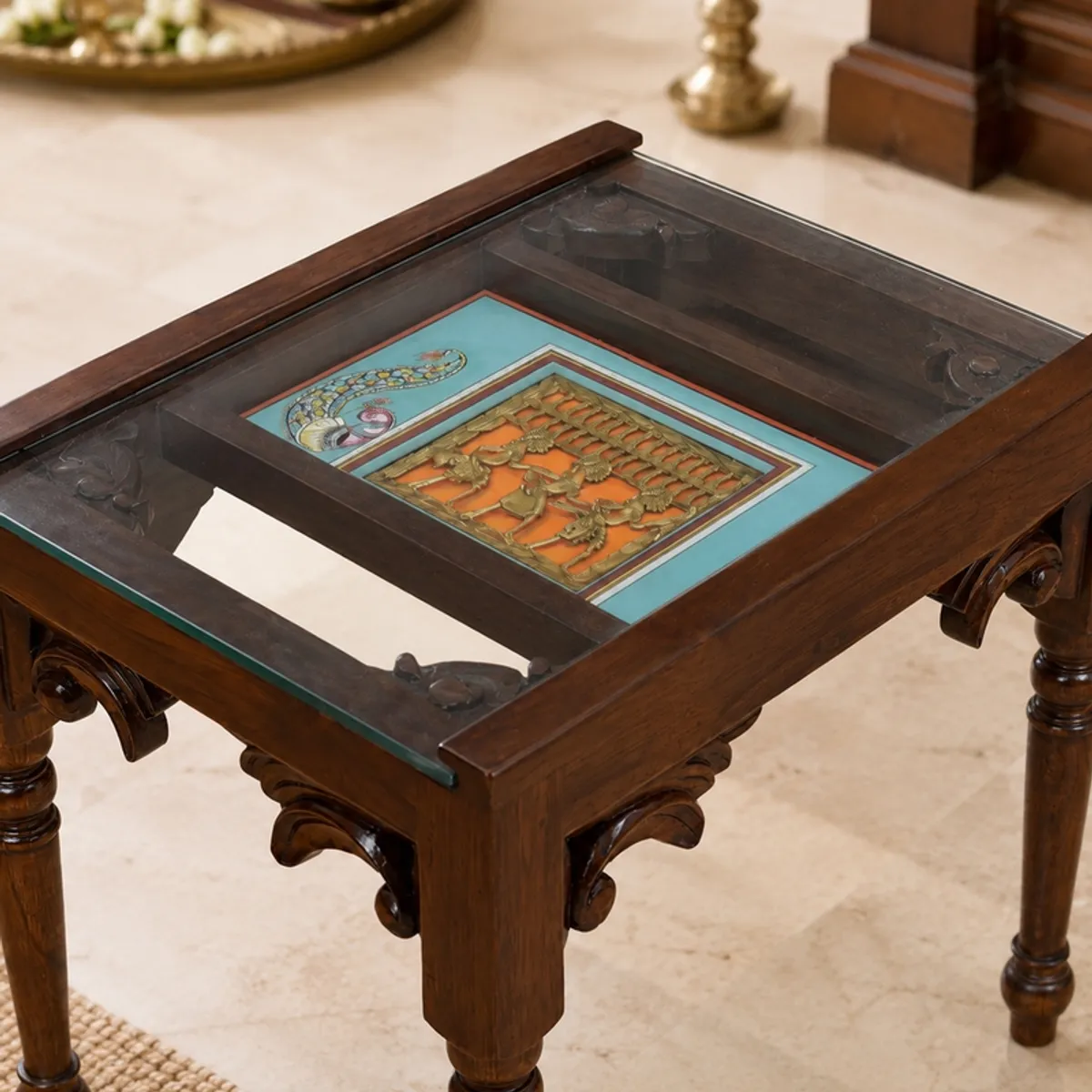 Close-up of brown side table top with decorative inset under glass