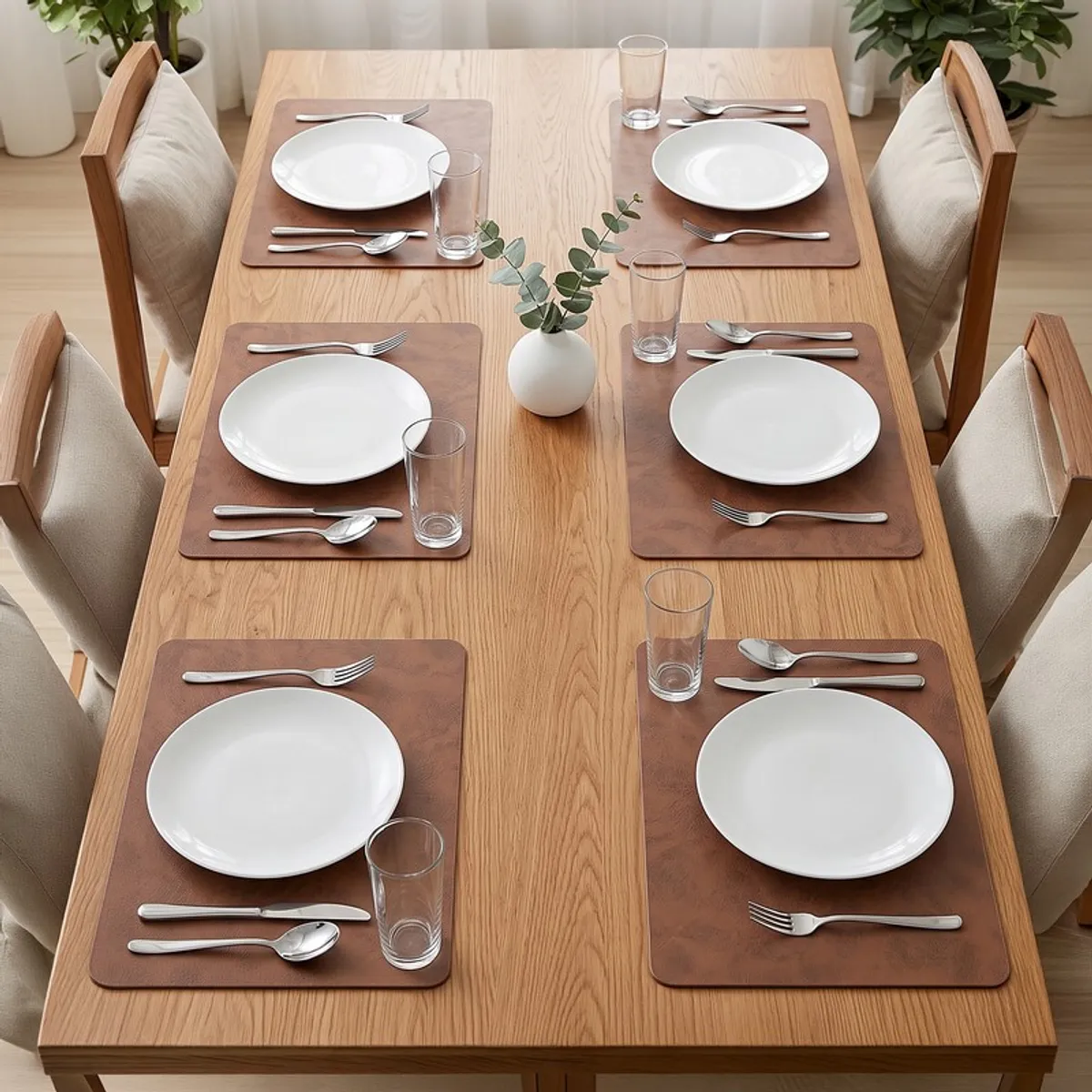 Six brown rectangular table mats arranged on a wooden dining table