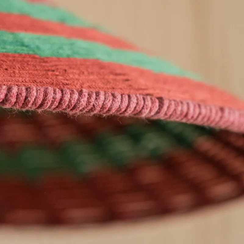 Close-up of the lamp shade edge showing textured red cotton surface