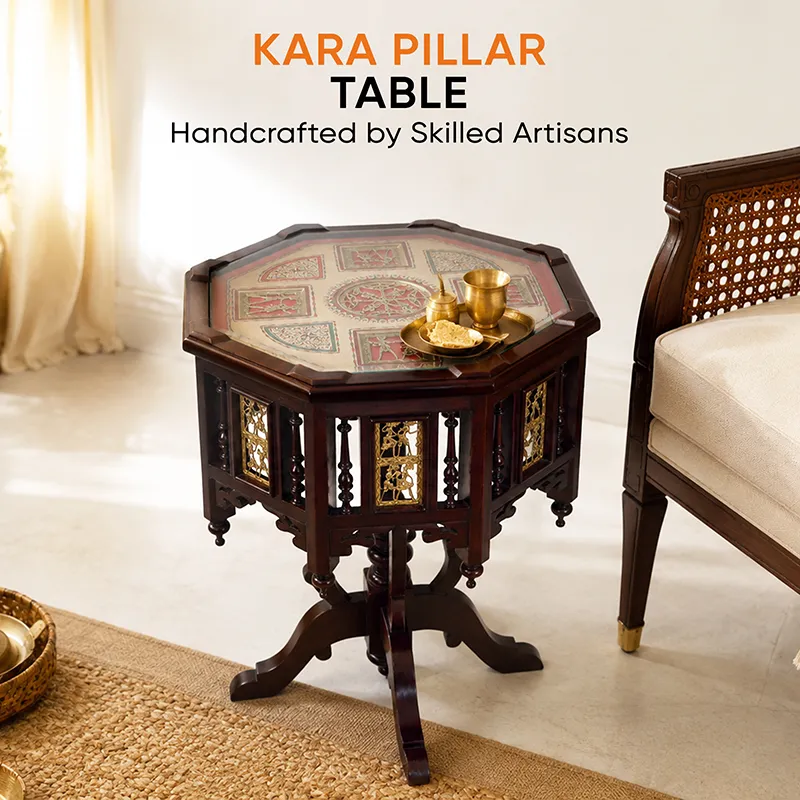 Kara pillar side table beside an armchair with brass serveware on top