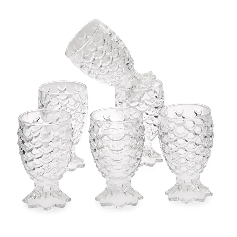 Set of six clear textured cocktail glasses on a white background