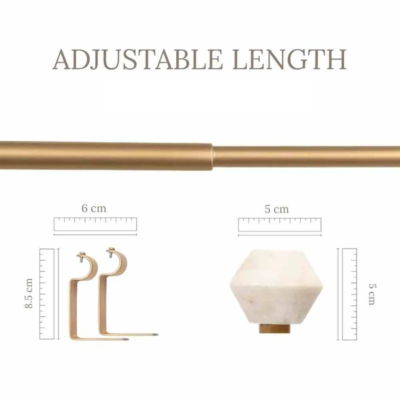 Gold extendable curtain rod with bracket and white hex finial detail