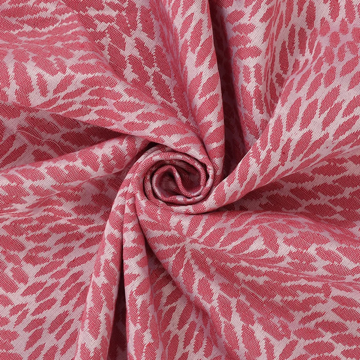 Close-up of pink woven throw fabric showing textured pattern