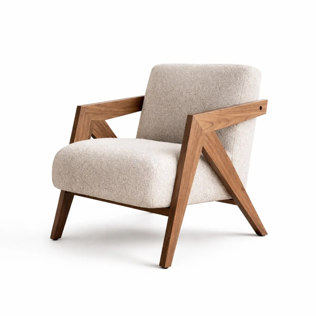 Reverse three-quarter view of a white upholstered teak wood accent chair