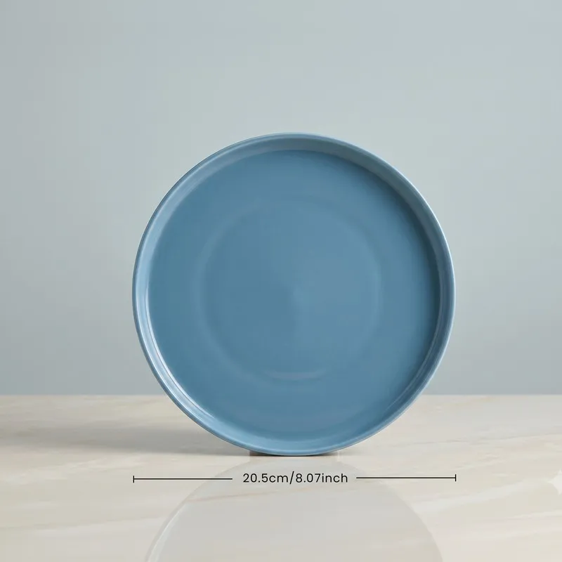 Single blue round plate with ribbed edge detail