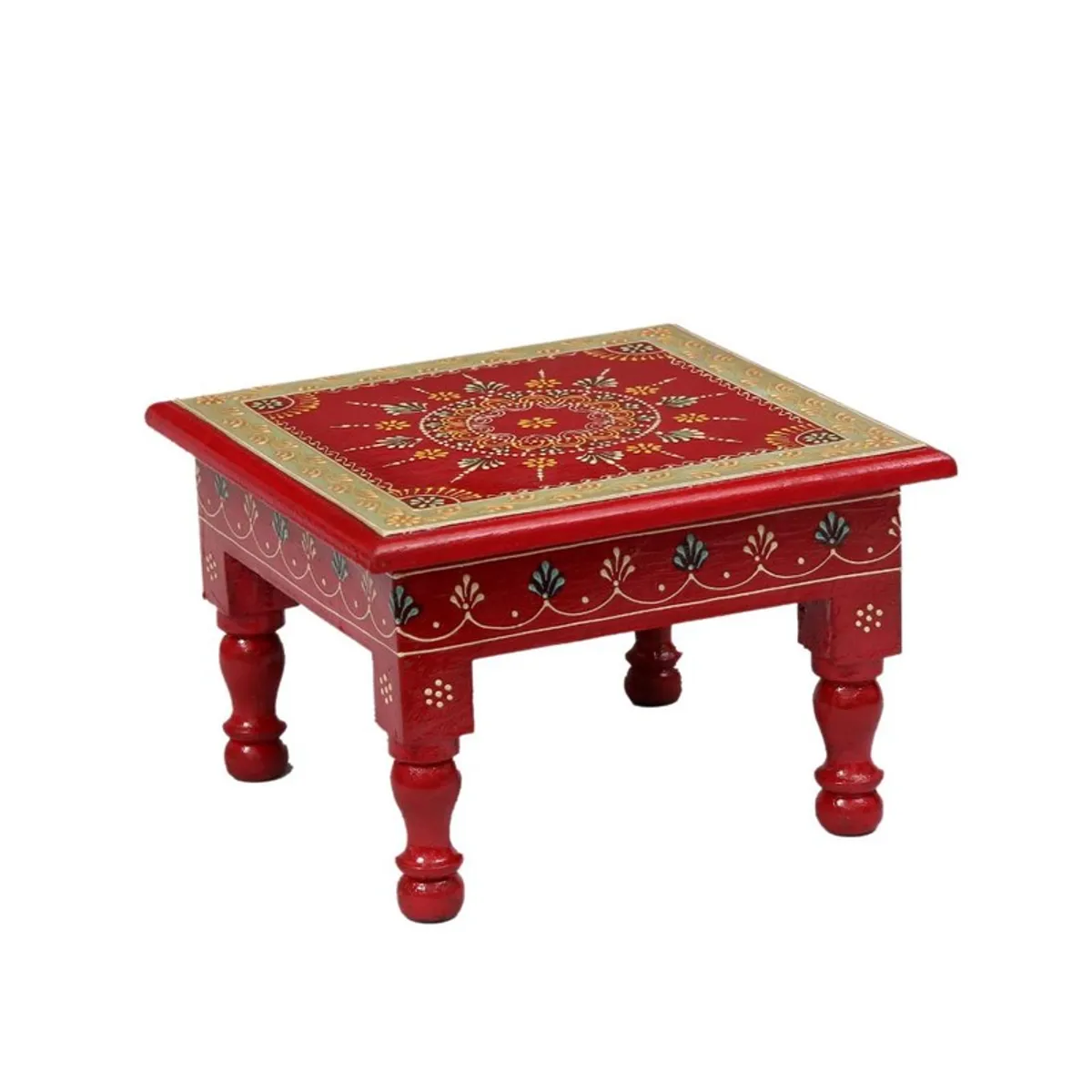 Angled view of a red wooden stool with painted traditional detailing