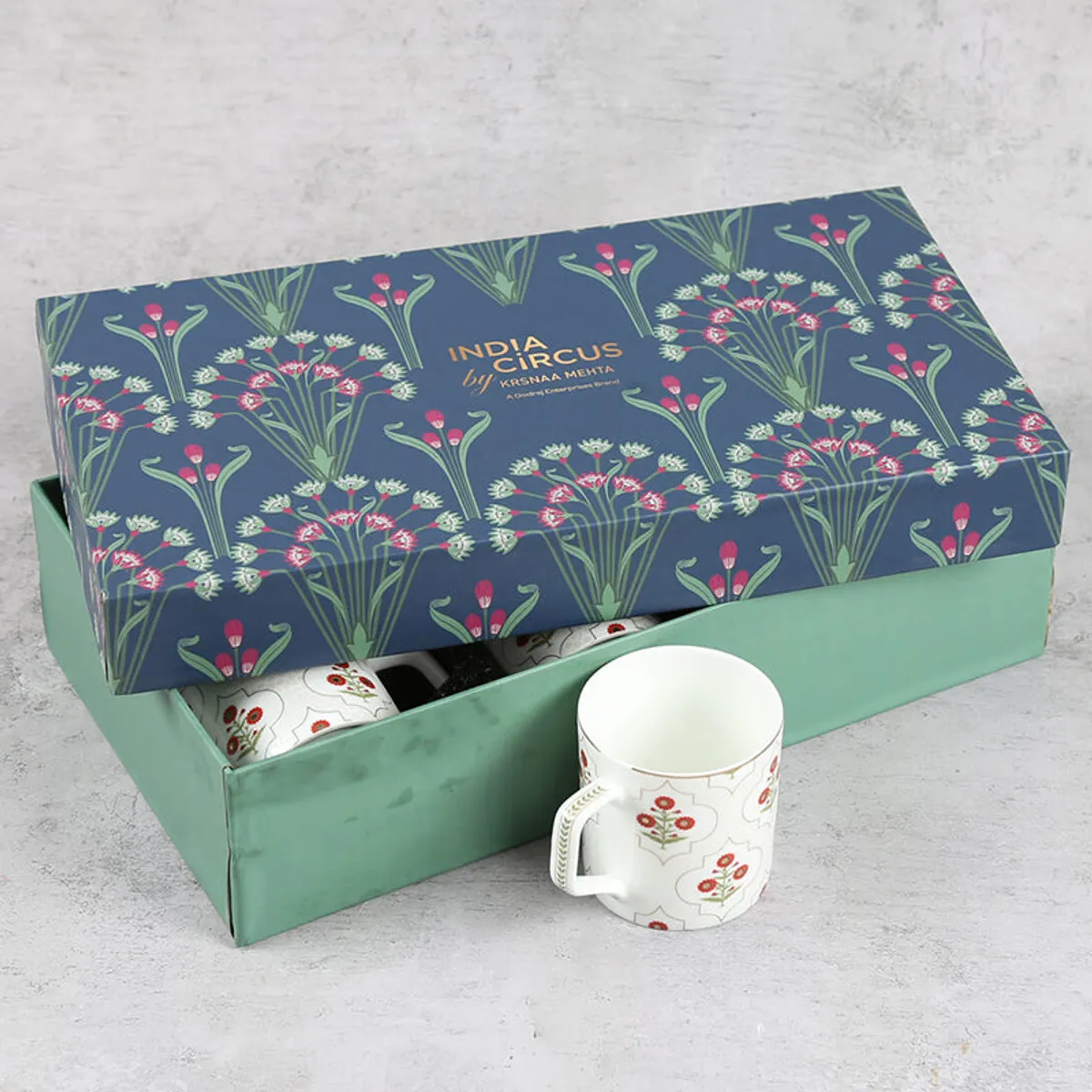 Floral India Circus gift box opened to show an ivory patterned tea cup.