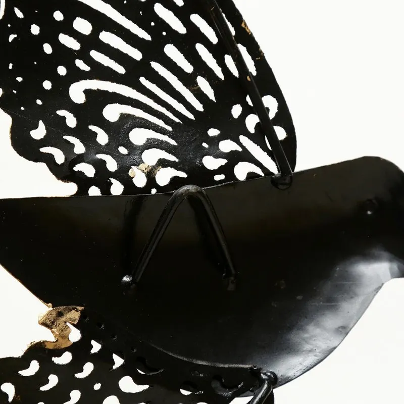 Rear view of the metal bird wall accent showing wall-mount structure