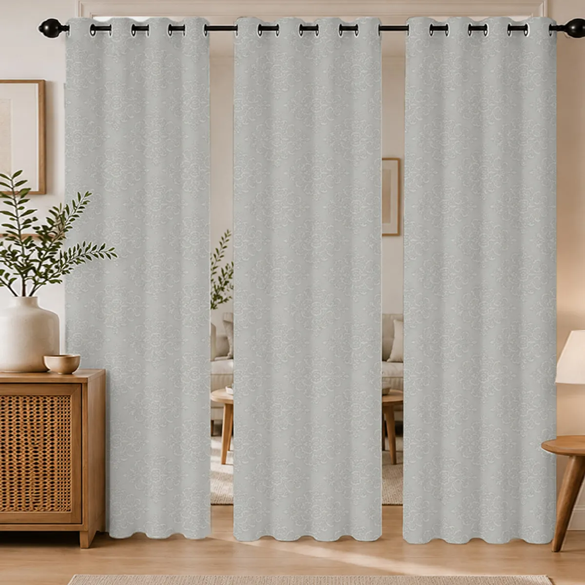 Set of three grey eyelet curtains with subtle floral damask-style pattern