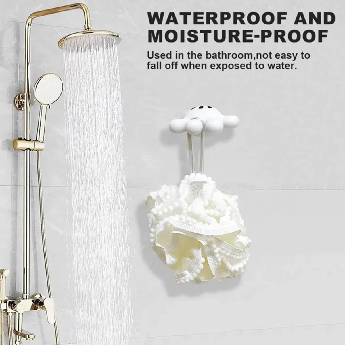 White suction wall hook holding a bath sponge in a shower area