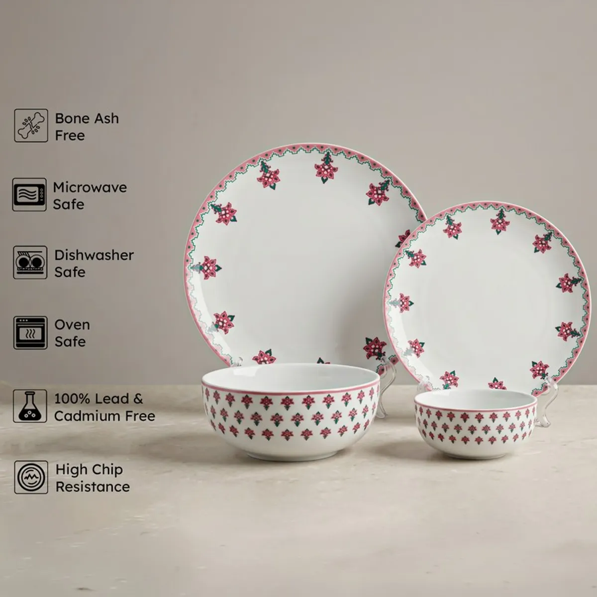 Porcelain plates and bowls from the dinner set with pink floral border pattern
