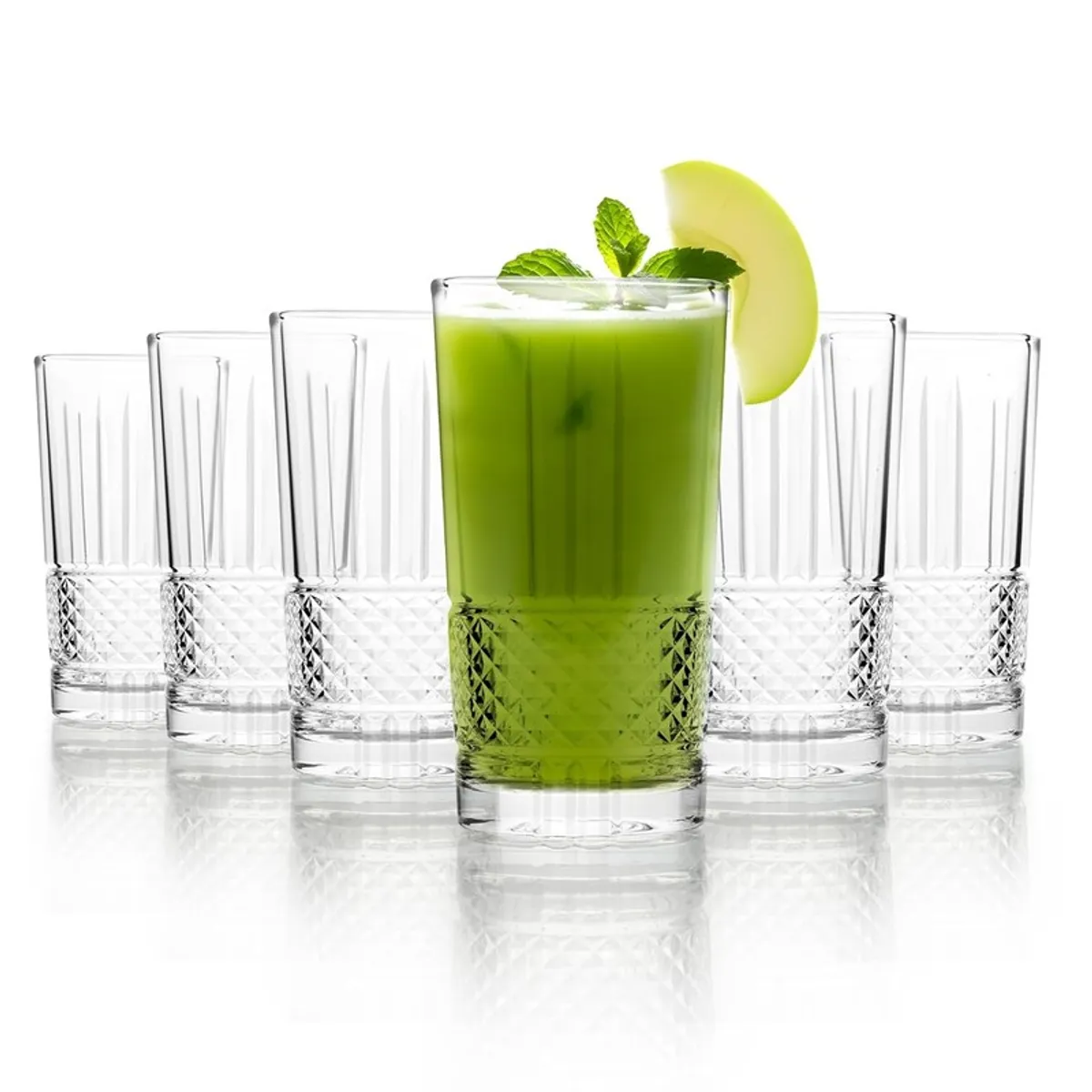 Transparent textured drinking glasses arranged around one glass filled with green juice.