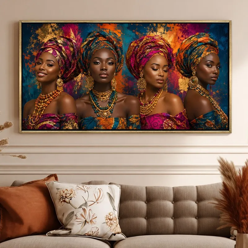 Framed multicolour portrait wall art styled above a tufted sofa with floral and rust cushions.