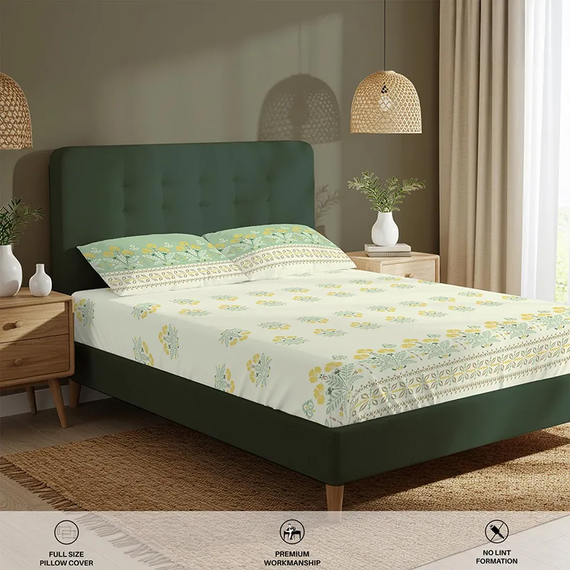 Styled bedroom view with floral fitted bedsheet in off-white, green and yellow