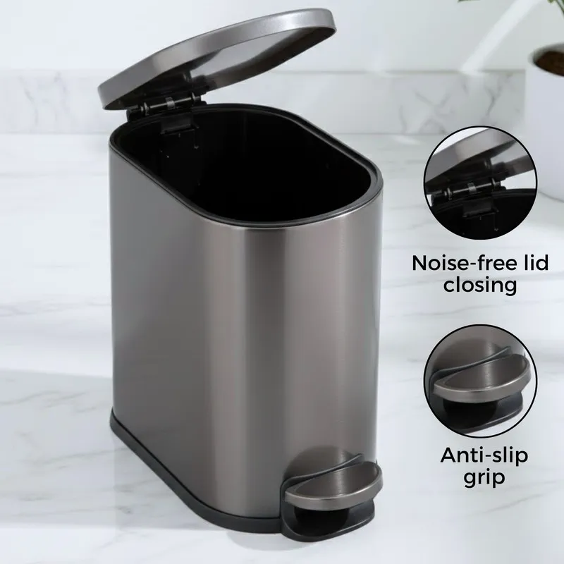 Open black metal pedal dustbin showing the inner compartment