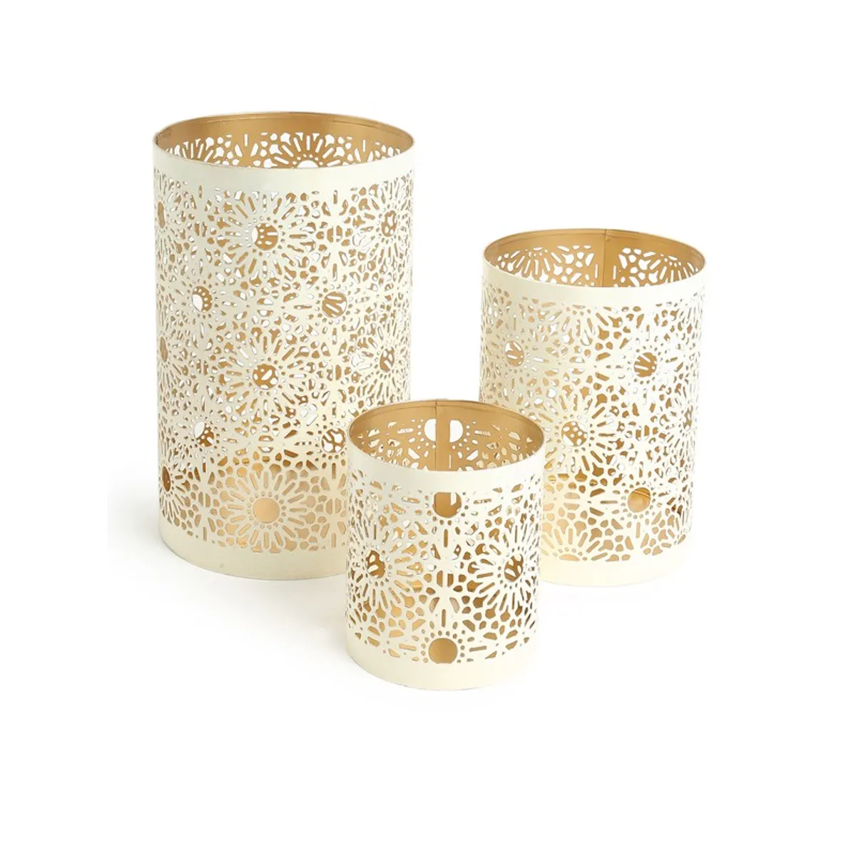 Three white floral lattice candle holders arranged against a plain white background