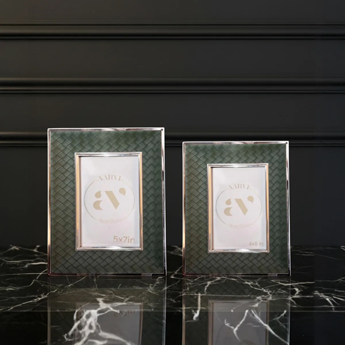 Two green photo frames in different sizes displayed together