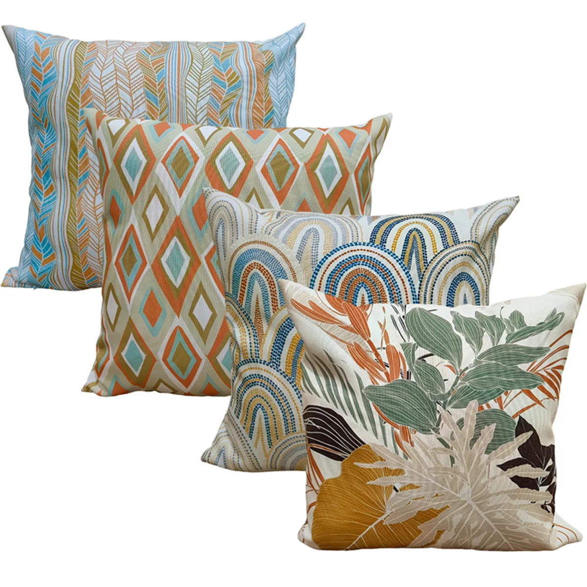 Four square cushion covers showing blue, orange, green and cream geometric and botanical prints