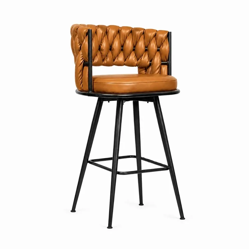 Three-quarter view of a brown faux leather bar stool with a black footrest