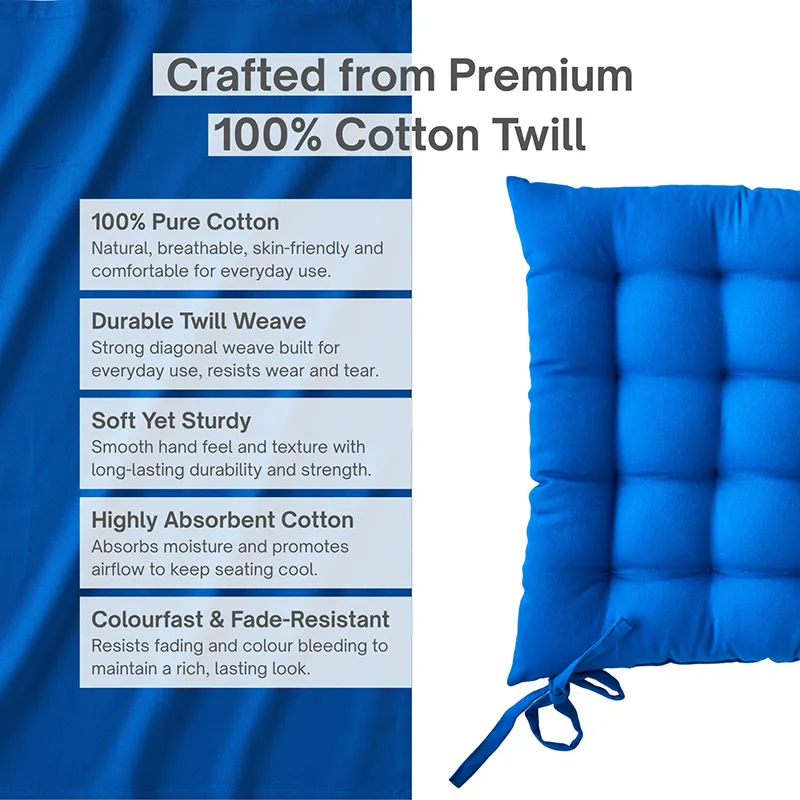 Close-up of a blue square tufted chair pad with tie straps.