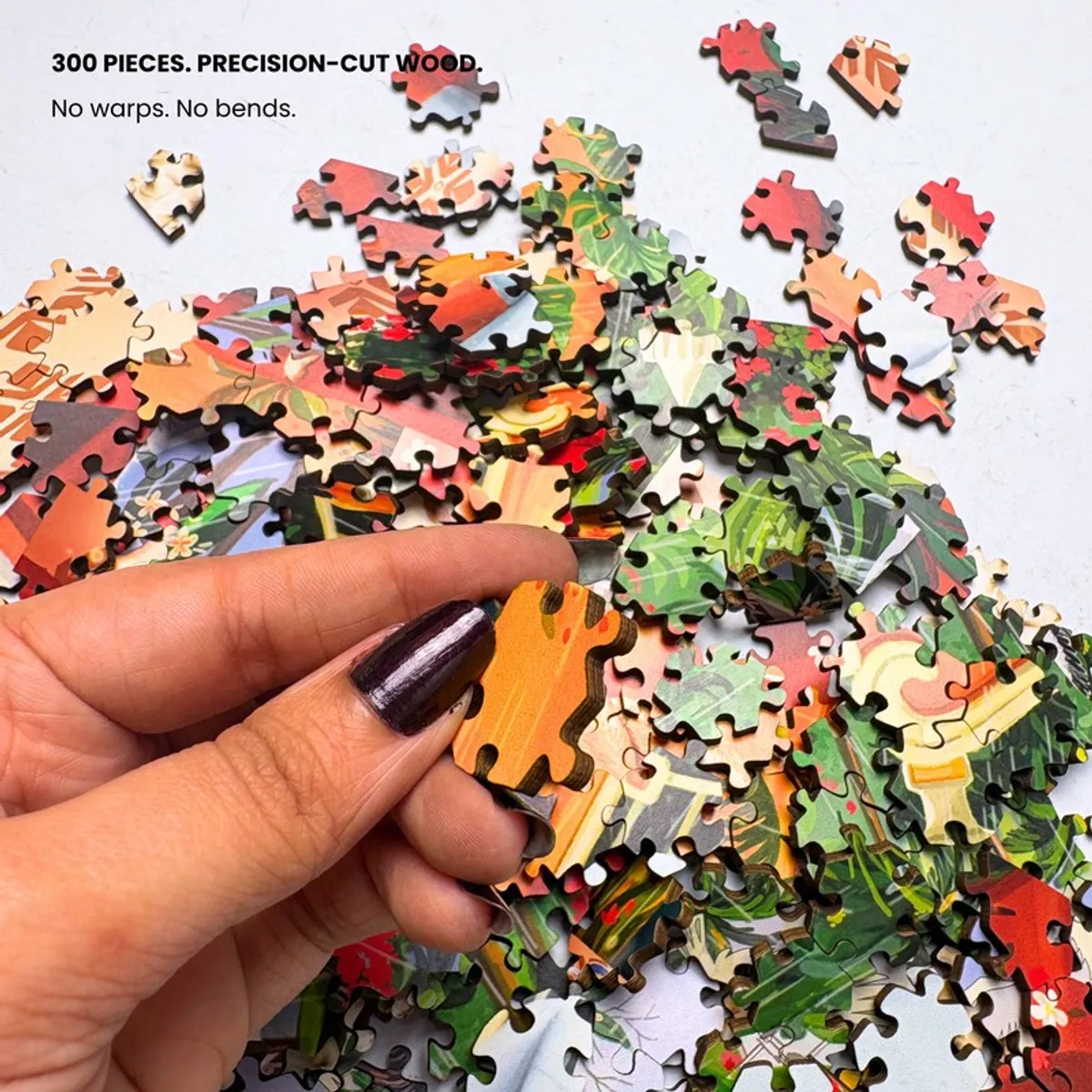 Close-up of loose puzzle pieces with colourful printed artwork