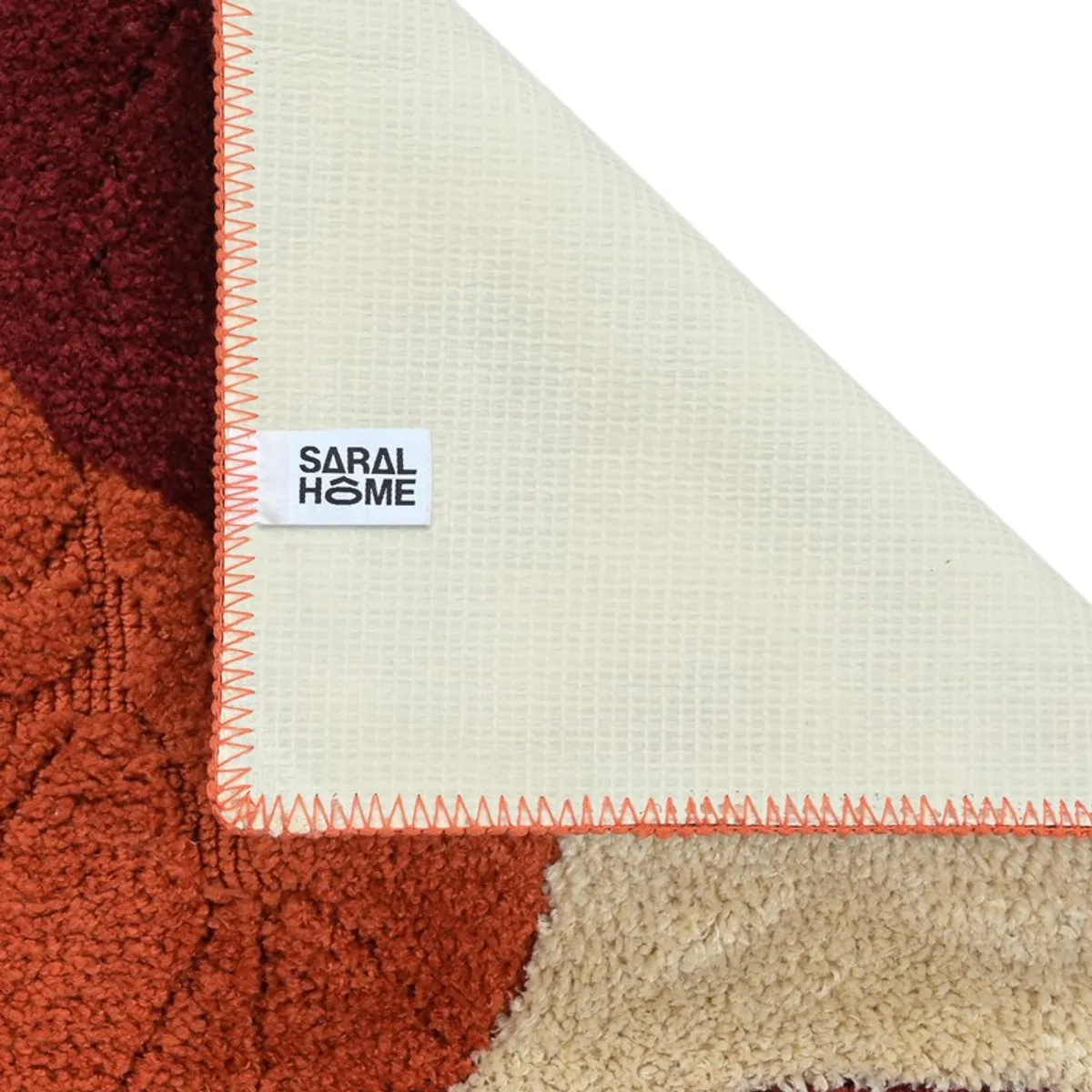 Underside of the rust bath mat showing its textured anti-skid backing