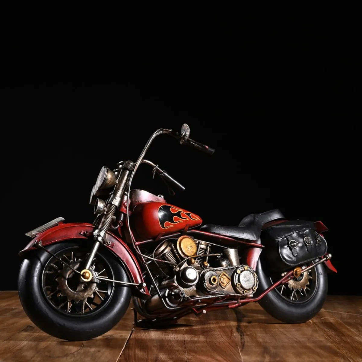 Side view of red motorcycle showpiece with black seat and saddlebag