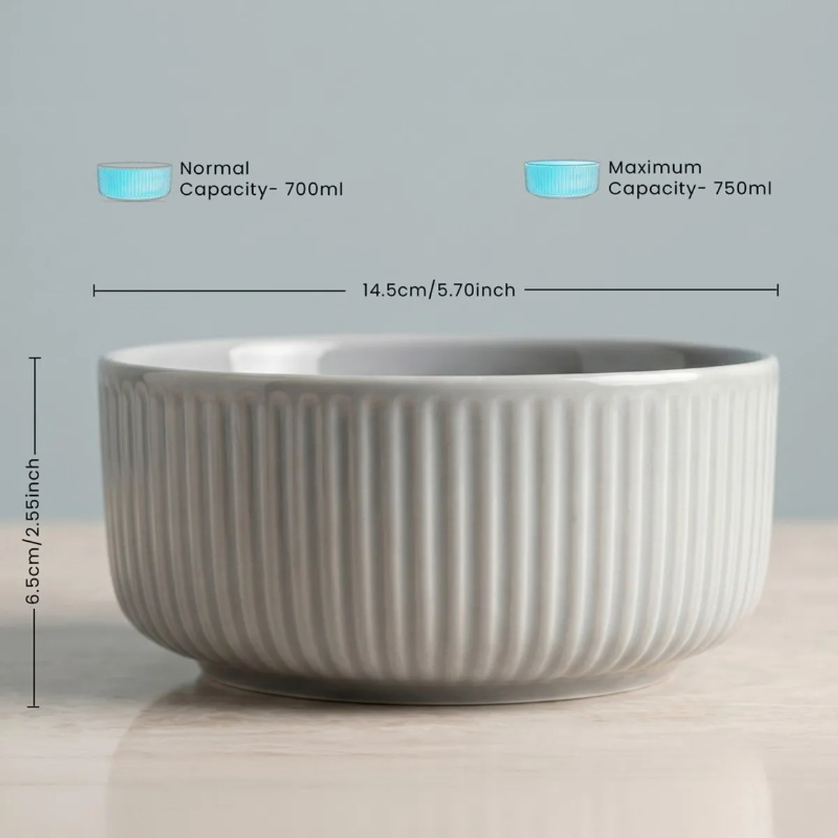 Grey ribbed round serving bowl on a tabletop