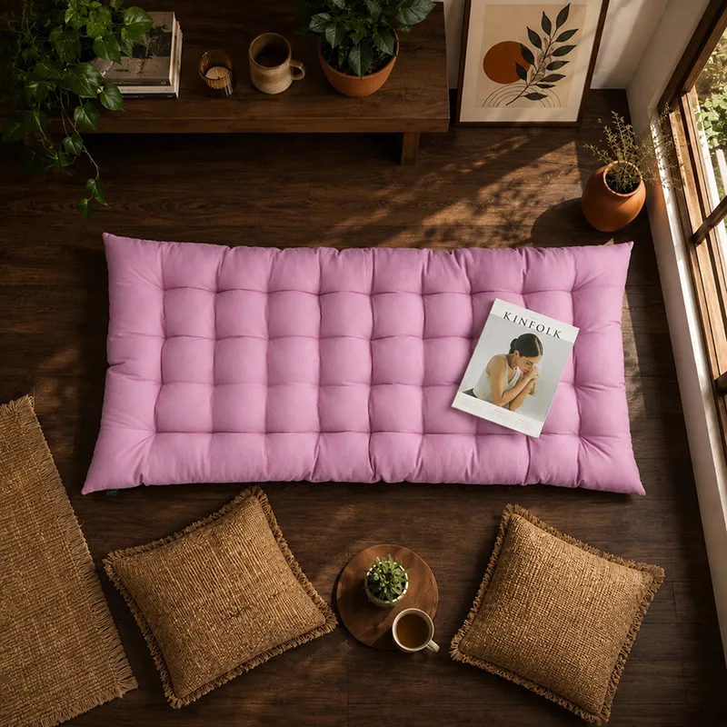 Lilac purple rectangular floor cushion styled on a wooden floor with decor