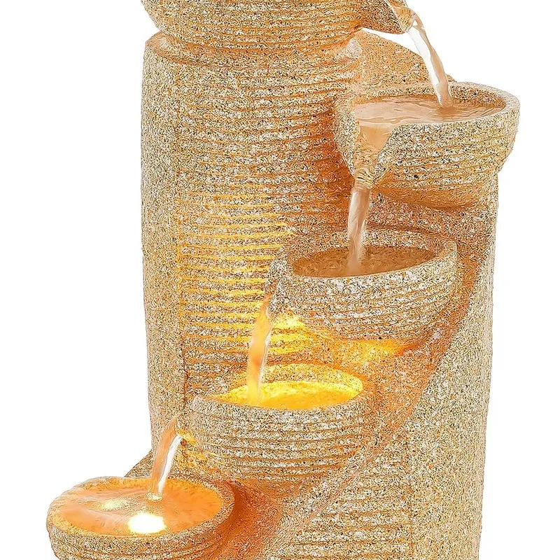 Close-up front section of illuminated cascading bowls on the fountain