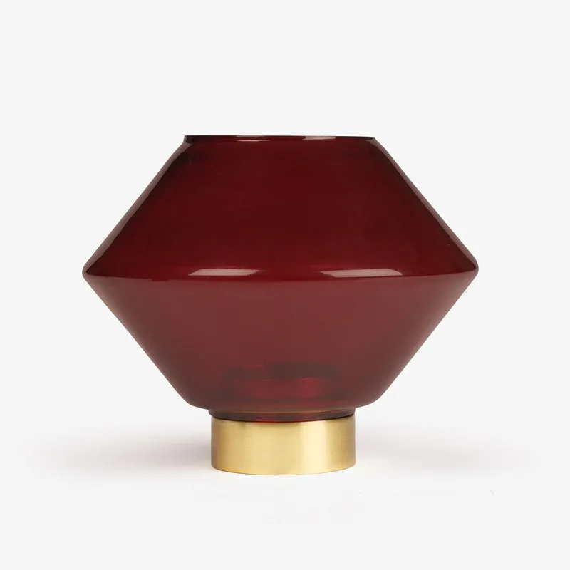 Front view of ruby red glass candle holder with gold base