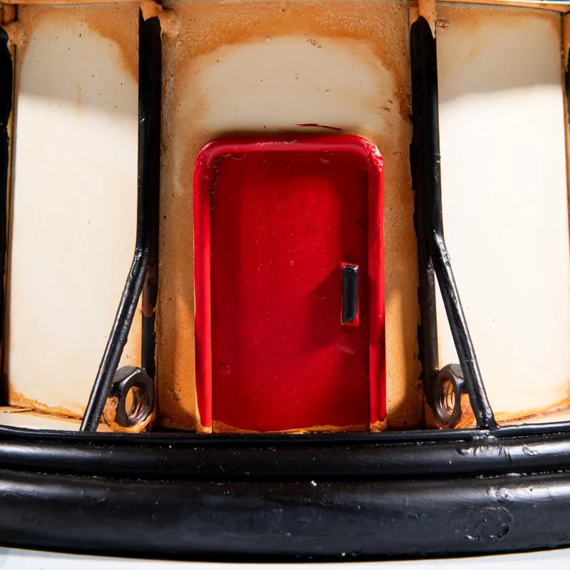 Close-up of the red door detail at the base of the lighthouse showpiece