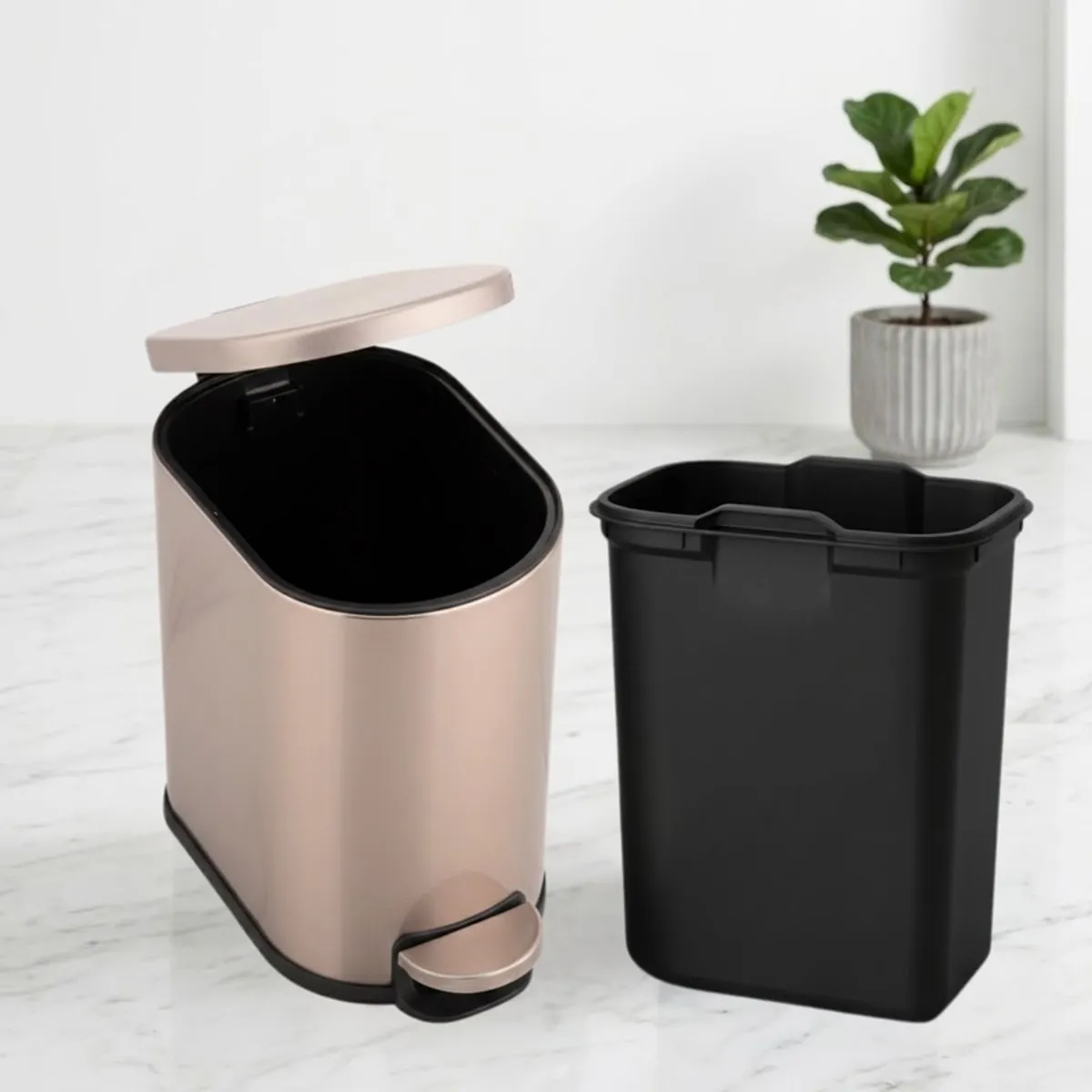 Gold metal dustbin with removable black inner bucket beside it