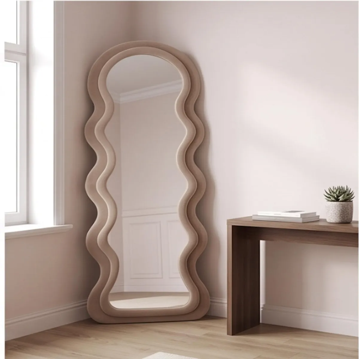 Brown ripple-edge floor mirror leaning against a wall beside a console
