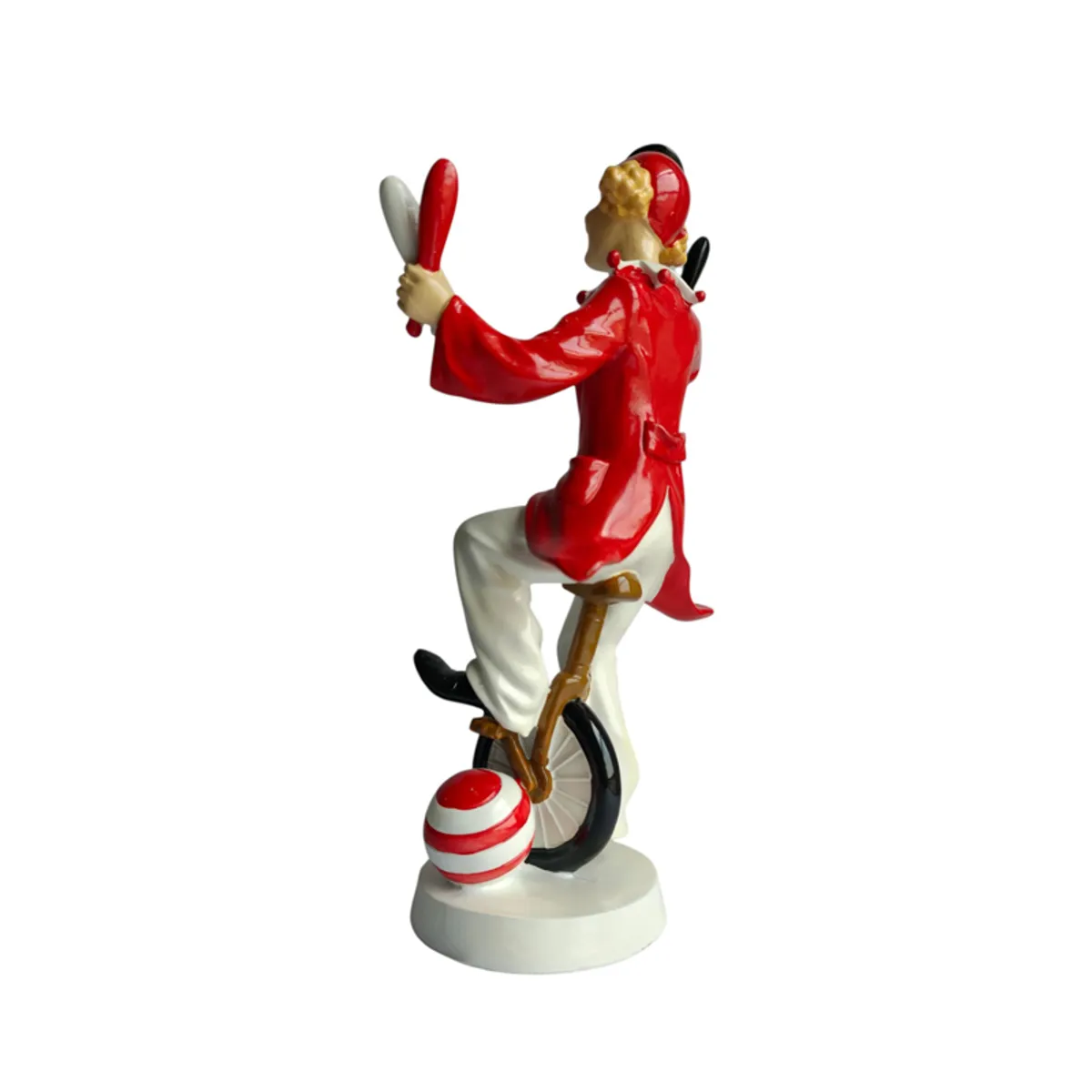 Rear three-quarter view of the red and white unicycle clown figurine