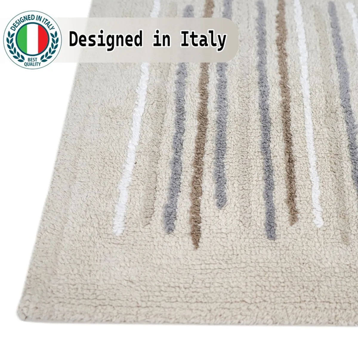 Close-up of the beige bath mat's soft textured surface and muted stripe pattern.