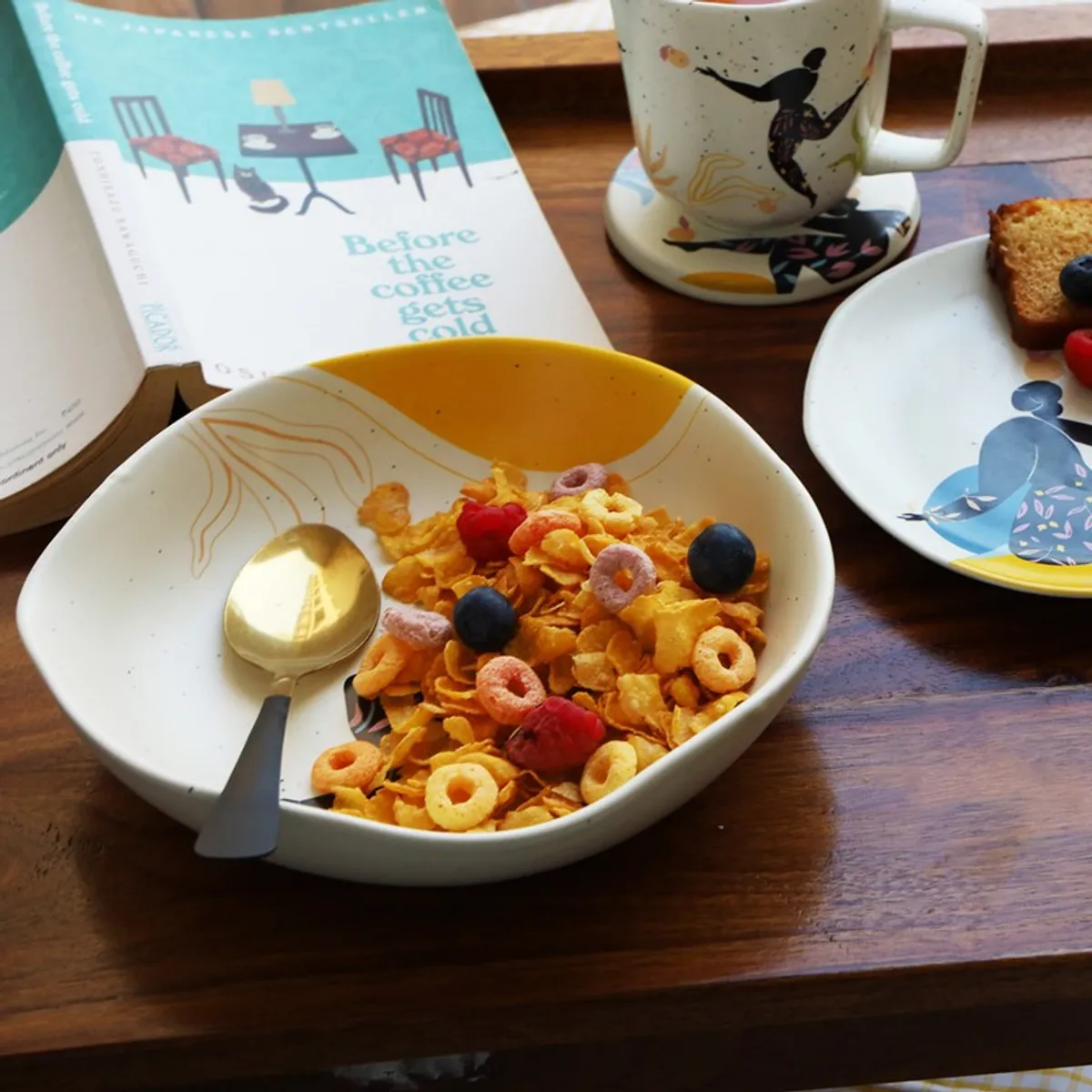 Pasta plate filled with cereal and berries, showing its illustrated multicolour design
