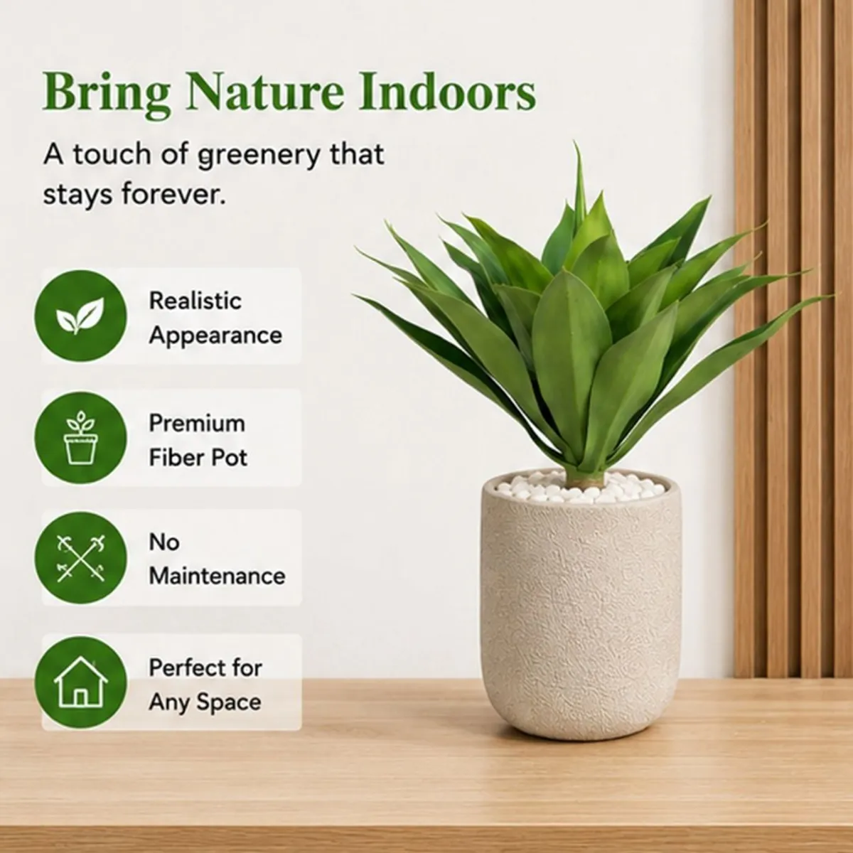 Green artificial succulent plant shown against a light wall with broad layered leaves