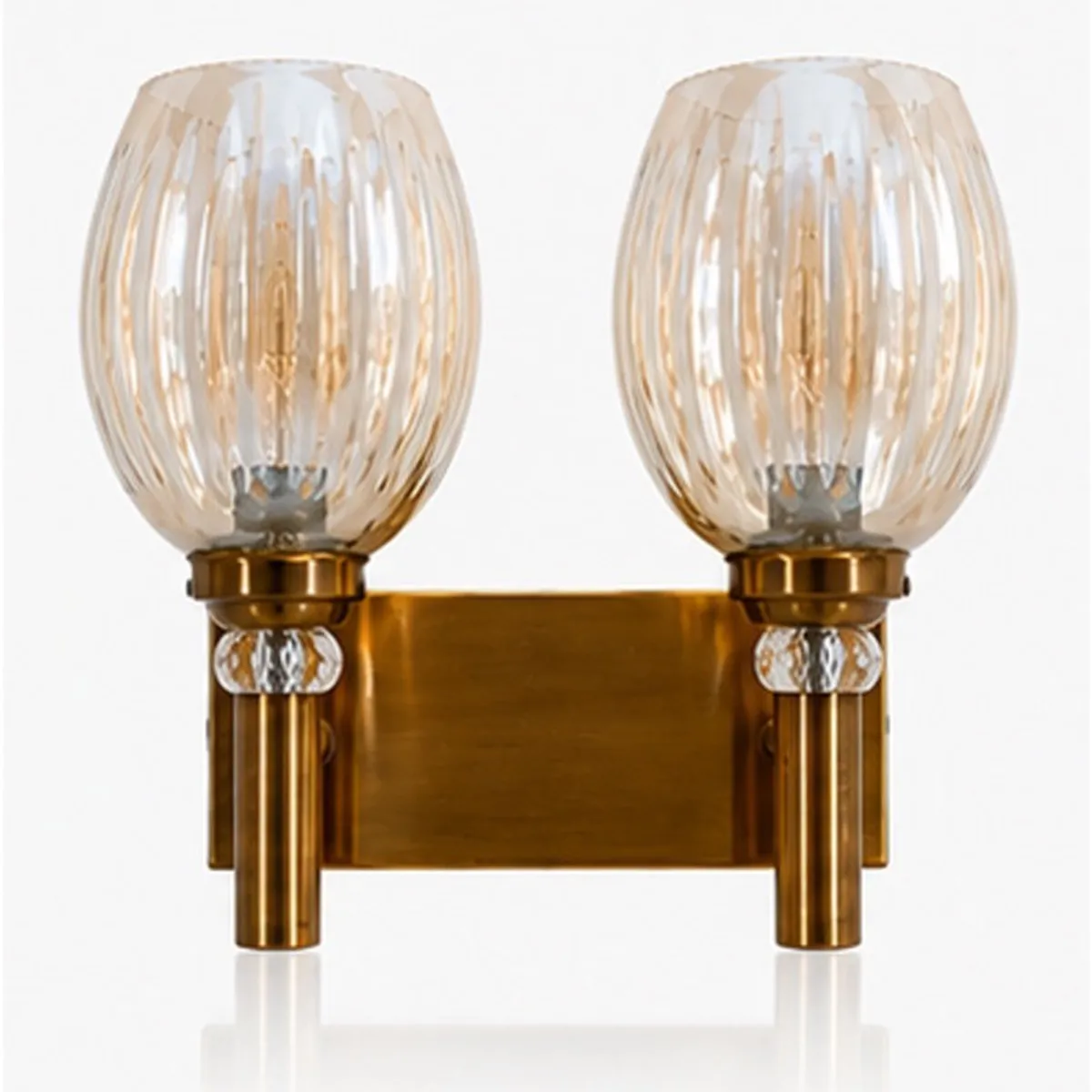 Gold twin-globe wall lamp shown against a clean white background