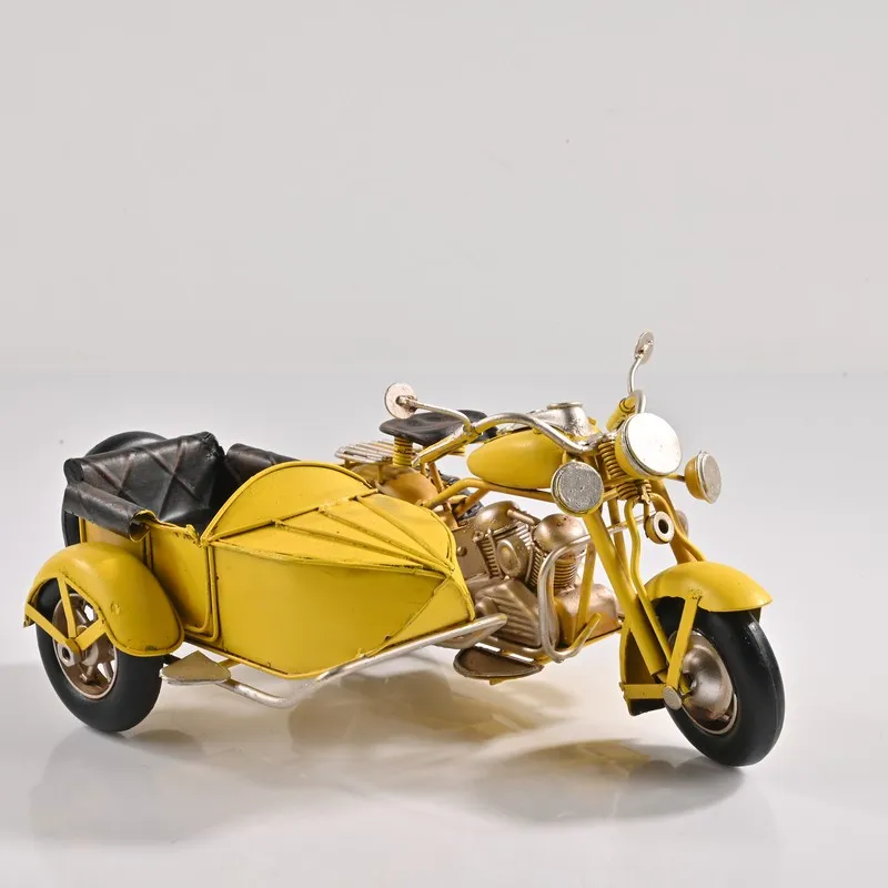 Yellow sidecar motorcycle showpiece on a white background
