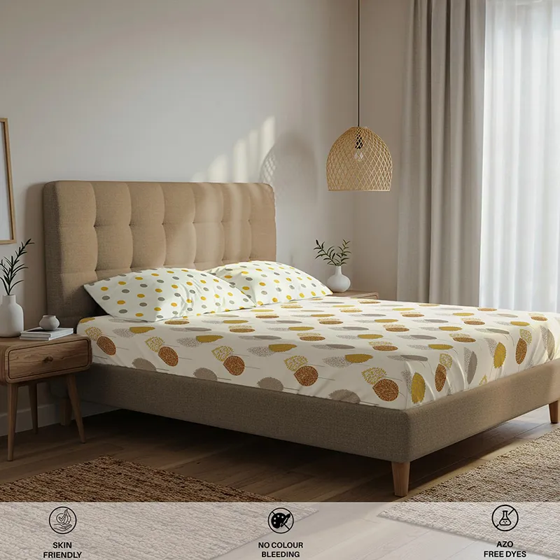 Angled view of white and yellow printed bedsheet in a contemporary bedroom