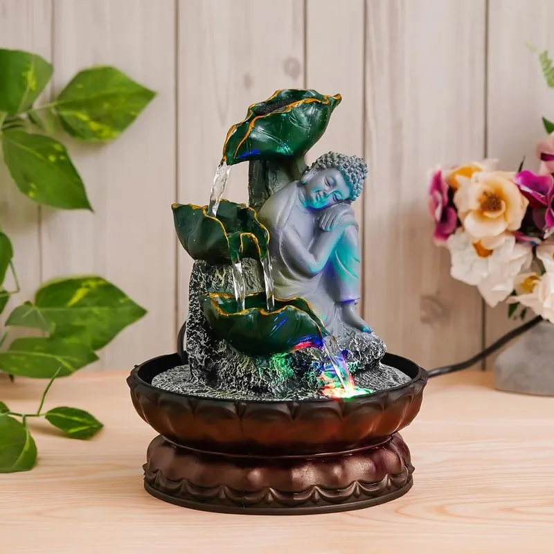 Angled view of Buddha leaf fountain with LED lights and water flow