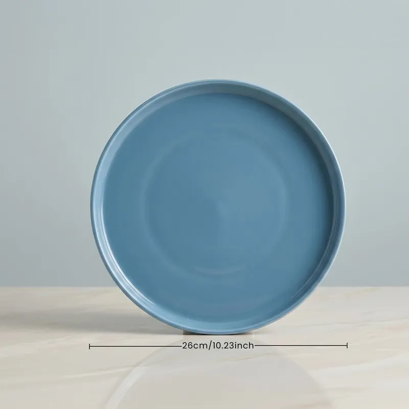 Single blue glossy dinner plate with ribbed edge detail