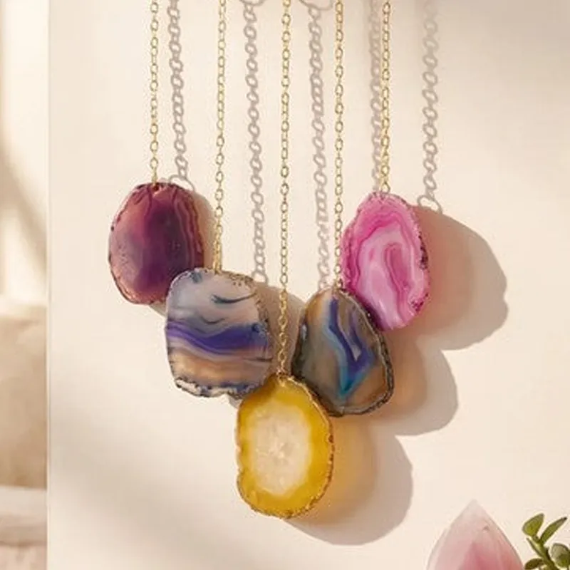 Close-up of colourful stone-like hanging details and metal chains