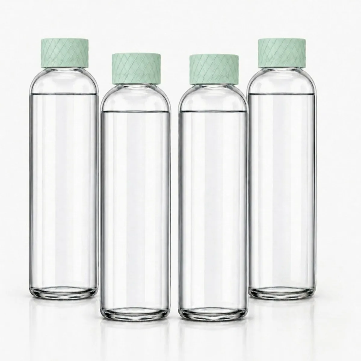 Four tall clear glass bottles with mint green textured caps arranged against a white background.