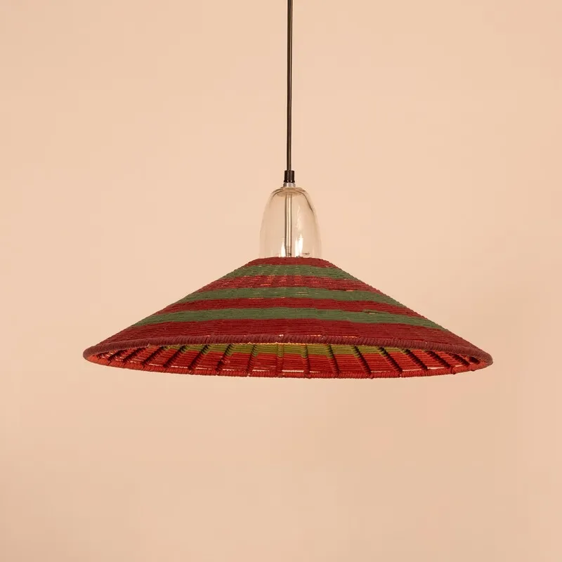 Festive red and green striped ceiling lamp against a plain backdrop