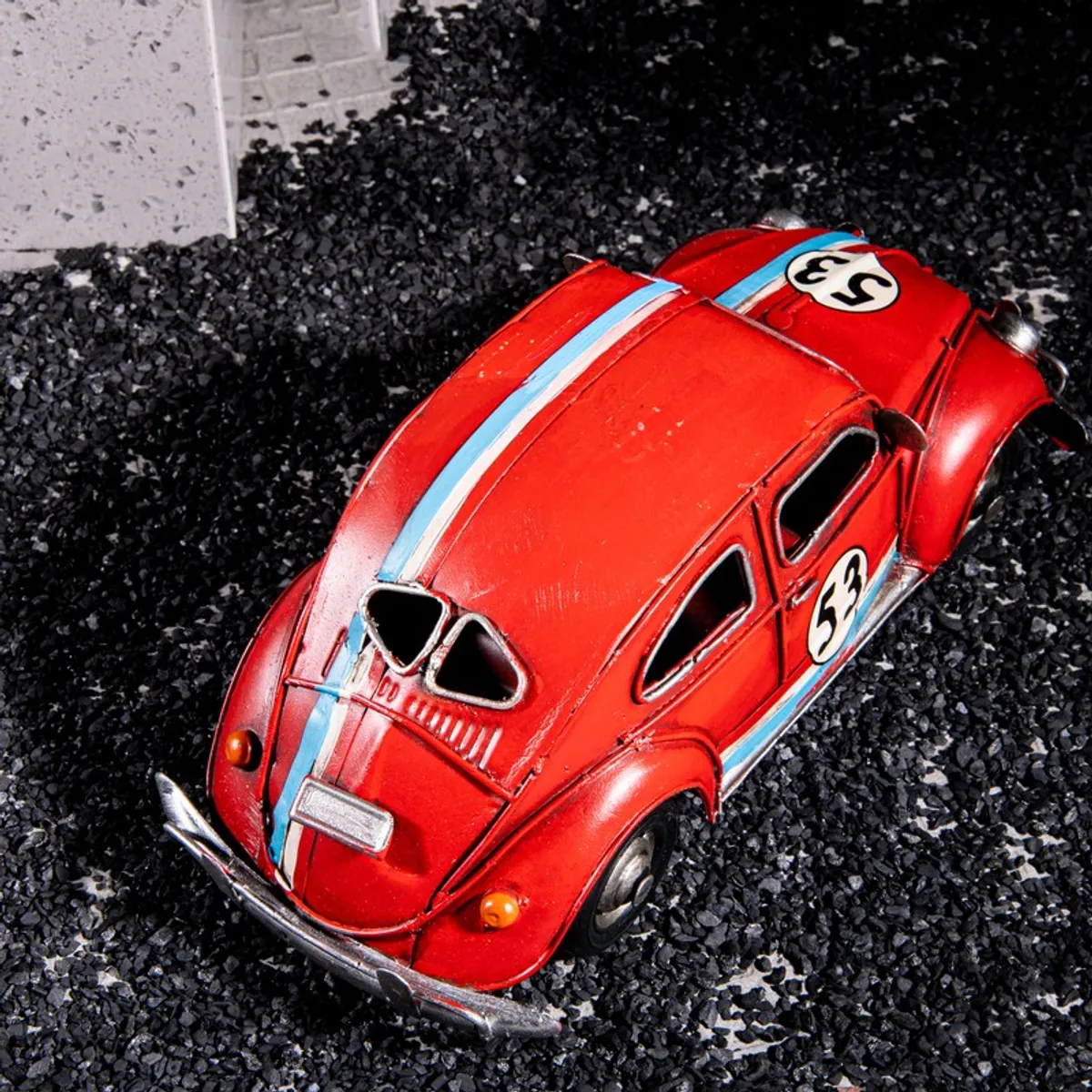Top rear view of the red vintage car showpiece with blue stripe detail