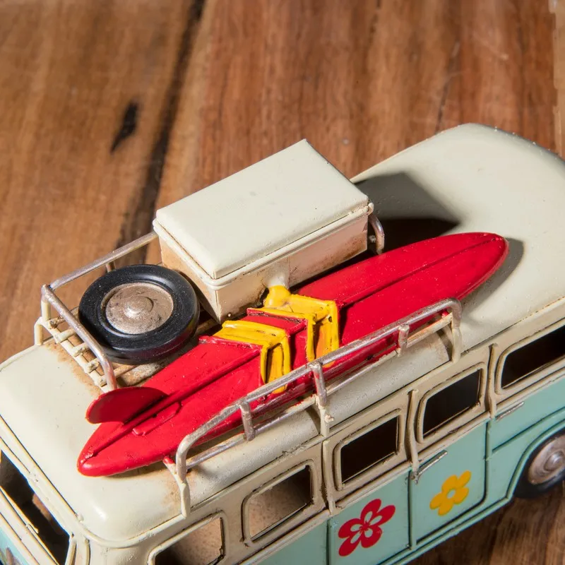 Top view of caravan showpiece with roof rack and red surfboard detail